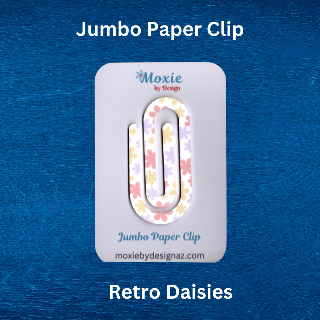Colorful retro daisy design jumbo paper clip on a blue background, perfect for organizing papers.